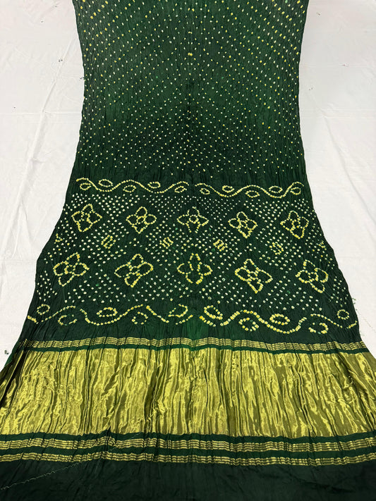 Single dot white n yellow bandhani saree including blouse...Dark green